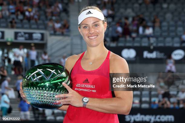 Angelique Kerber of Germany poses with the winners trophy after the Women's Singles Final match against Ashleigh Barty of Australia during day seven...