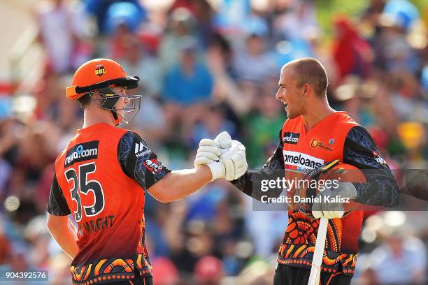 Hilton Cartwright of the Perth Scorchers and Ashton Agar of the Perth Scorchers celebrate after defeating the Strikers during the Big Bash League...