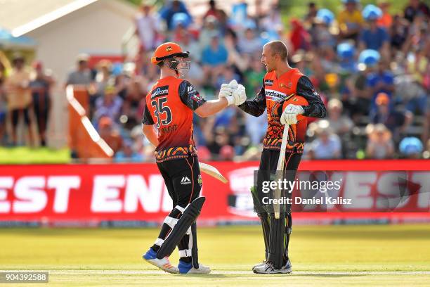 Hilton Cartwright of the Perth Scorchers and Ashton Agar of the Perth Scorchers celebrate after defeating the Strikers during the Big Bash League...