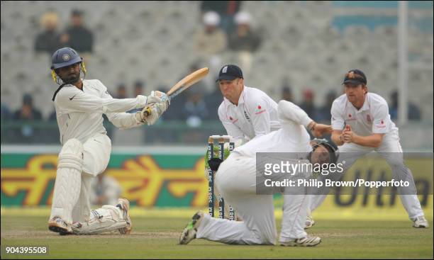 England fielder Ian Bell ducks to avoid a shot from Indian batsman Harbhajan Singh during the 2nd Test match between India and England at the Punjab...