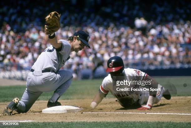 S: First baseman Don Mattingly of the New York Yankees puts a sweeping tag on Julio Franco of the Cleveland Indians diving back into first base...