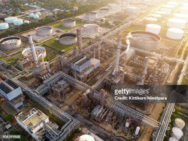 aerial view of twilight of oil refinery ,shot from drone of oil refinery and petrochemical plant at dusk , bangkok, thailand - oil refinery stock pictures, royalty-free photos & images