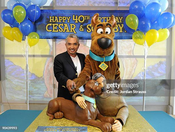 Dog trainer Cesar Milan and Scooby-Doo celebrate their 40th birthdays at the East Valley Shelter on September 8, 2009 in Van Nuys, California....