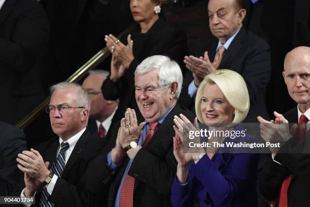 Newt Gingrich, former Speaker of the United States House of Representatives, and his wife, Callista, react during President Donald J. Trumps first...