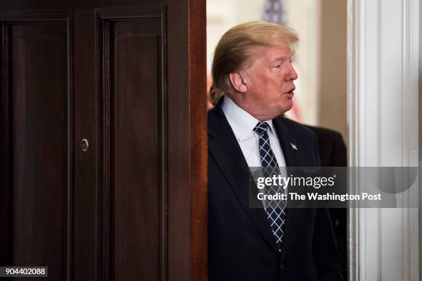 President Donald Trump arrives to sign a proclamation to honor Martin Luther King, Jr. Day, in the Roosevelt Room at the White House in Washington,...