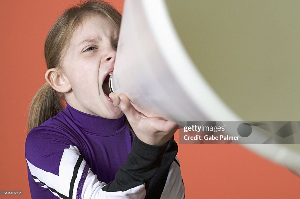 Girl shouting into megaphone