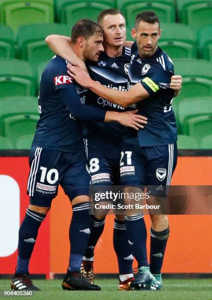 James Troisi of the Victory celebrates with Besart Berisha and Carl Valeri after scoring his sides first goal during the round 16 A-League match...