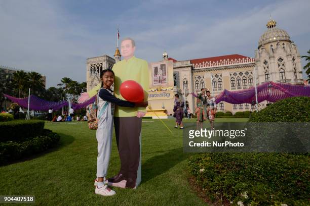 Children play next to a cardboard cutout of Thailand's Prime Minister Prayuth Chan-ocha during the Children's Day celebration at Government House in...
