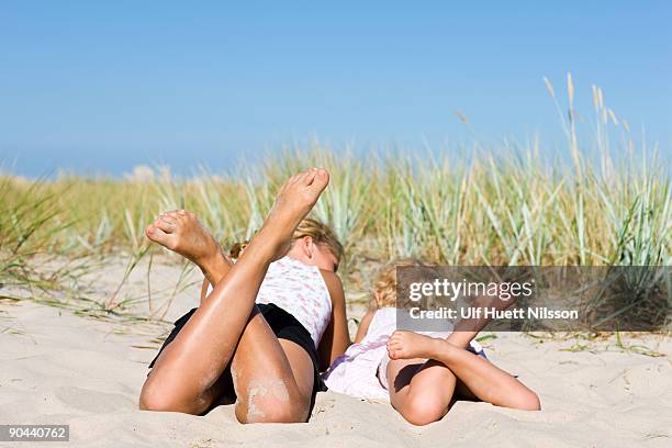 two girls on a beach oland sweden. - sunbathing stock pictures, royalty-free photos & images