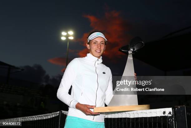 Elise Mertens of Belgium poses with the winner's trophy after she defeated Mihaela Buzarnescu of Romania during the 2018 Hobart International at...