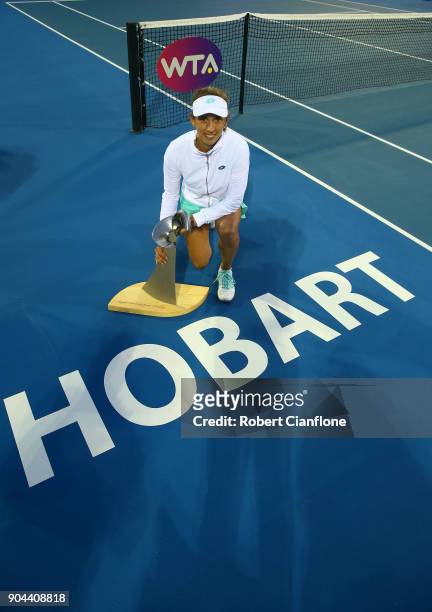 Elise Mertens of Belgium poses with the winner's trophy after she defeated Mihaela Buzarnescu of Romania during the 2018 Hobart International at...