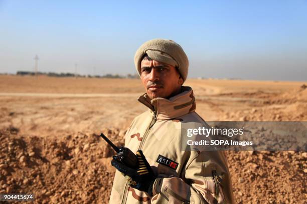 An Iraqi soldier calling in airstrikes on IS positions between Hamam Al Alil and Mosul. On the front lines with the Iraqi army and Hashd al-shaabi...