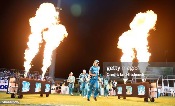 The Heat run onto the field during the Women's Big Bash League match between the Brisbane Heat and the Melbourne Stars on January 13, 2018 in Mackay,...