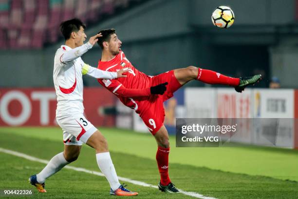 Oday Dabbagh of Palestine kicks the ball during the AFC U-23 Championship Group B match between Palestine and North Korea at Jiangyin Stadium on...