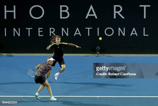 Elise Mertens of Belgium plays a shot as Demi Schuurs of the Netherlands looks on during the doubles final againstsLyudmyla Kichenok of the Ukraine...
