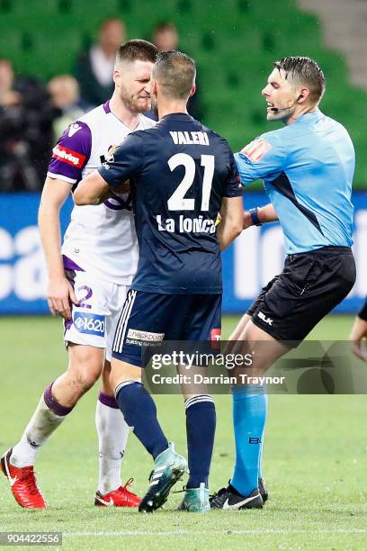 Alex Grant of Perth Glory and Carl Valeri of Melbourne Victory argue during the round 16 A-League match between the Melbourne Victory and Perth Glory...