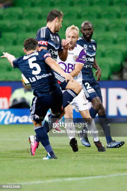 Mitchell Nichols of Perth Glory takes on the Melbourne Victory defense during the round 16 A-League match between the Melbourne Victory and Perth...