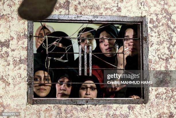 Relatives mourn during the funeral of Abdullah Zeidan, a 33-year-old fisherman, in Gaza City on January 13, 2018. A fisherman from the Gaza Strip was...