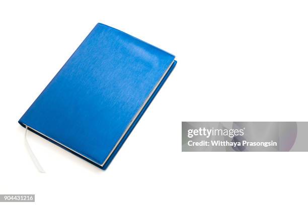 blue notebook isolated on white background. - book table stockfoto's en -beelden