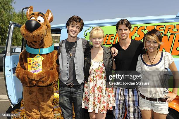 Actors Nick Palatas, Kate Melton, Robbie Amell and Hayley Kiyoko from "Scooby Doo! The Mystery Begins" celebrate Scooby-Doo and Cesar Millan's 40th...