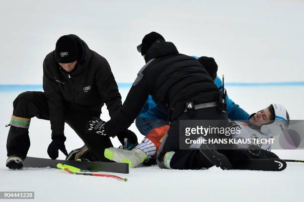 Hungary's Edith Miklos is treated after a crash during the FIS Alpine World Cup Women Super G on January 13, 2018 in Bad Kleinkirchheim. / AFP PHOTO...