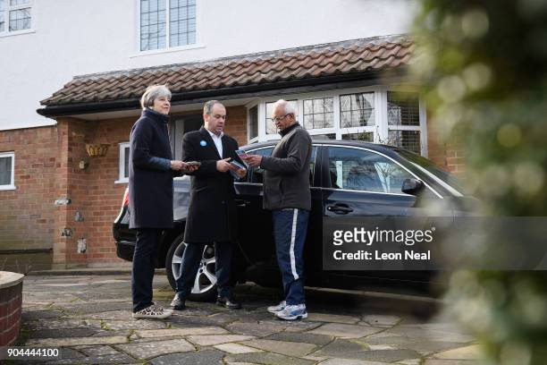British Prime Minister Theresa May joins MP for Sutton and Cheam Paul Scully as he campaigns for the vote in the London local elections in May, on...