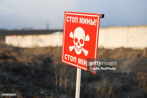 Sign &quot;Careful mines&quot; near Checkpoint &quot;Hnutove&quot; in Hnutove village, near Mariupol, Ukraine on 12 January 2018.