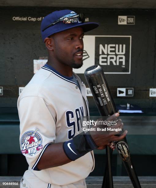 Tony Gwynn Jr. #18 of the San Diego Padres gets ready in the dugout before the game against the San Francisco Giants at AT&T Park on September 7,...