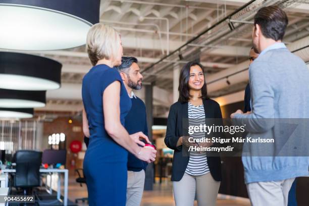 confident colleagues discussing in office meeting - events stock pictures, royalty-free photos & images