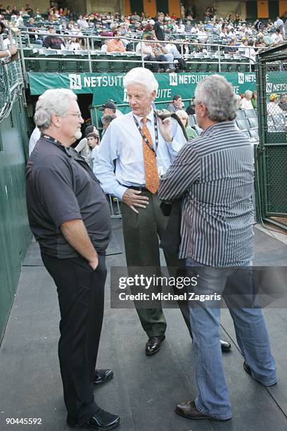 San Francisco Giants owner Bill Newkom talks with general manager Brian Sabean prior to the San Francisco Giants game against the Oakland Athletics...