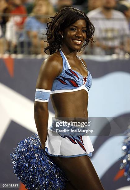 Cheerleader of the Tennessee Titans looks on against the Green Bay Packers during a preseason NFL game at LP Field on September 3, 2009 in Nashville,...