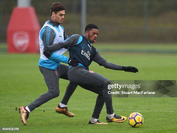 Konstantinos Mavropano and Chuba Akpom of Arsenal during a training session at London Colney on January 13, 2018 in St Albans, England.