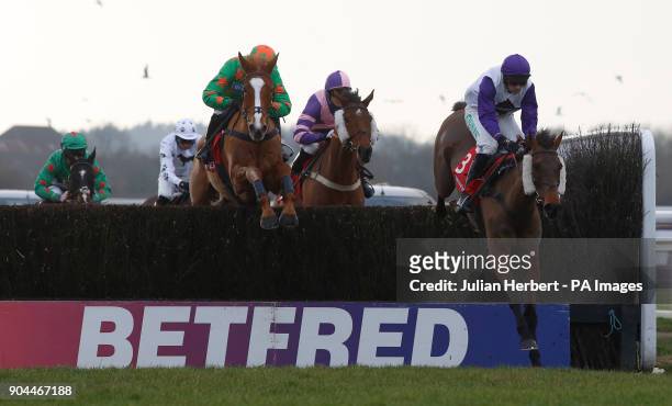 Parfois ridden by Sean Bowen clear an early fence before going on to win The Betfred Home Of Goals Galore Hampton Novices' Steeple Chase Race run...