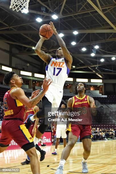 Archie Goodwin of the Northern Arizona Suns drives to the basket and shoots the ball against the Canton Charge during the NBA G-League Showcase on...