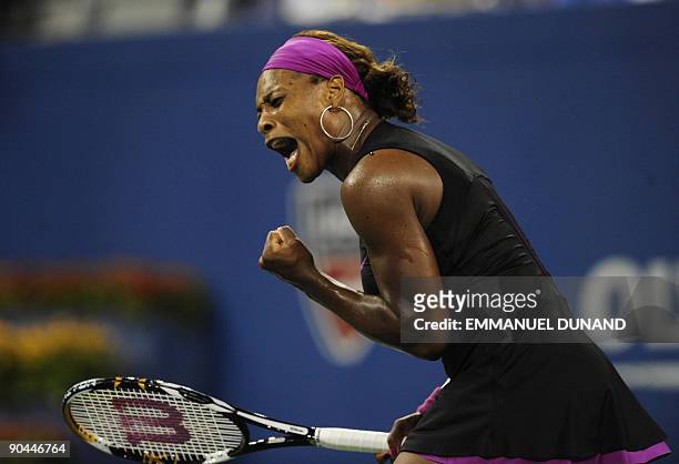 Tennis player Serena Williams reacts to a point to Italy's Flavia Pennetta during their quarterfinals match of the 2009 US Open at the USTA Billie...