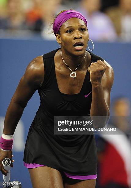 Tennis player Serena Williams celebrates after winning against Italy's Flavia Pennetta during their quarterfinals match of the 2009 US Open at the...