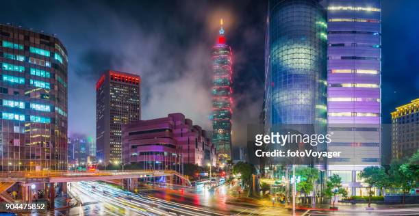 taipei downtown skyscrapers neon night zooming traffic highways panorama taiwan - taiwanese culture stock pictures, royalty-free photos & images