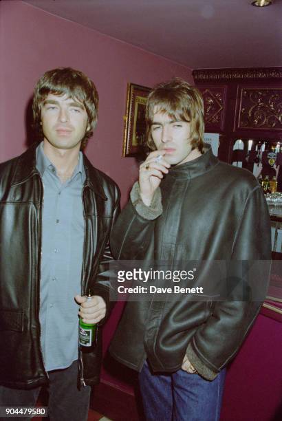British musicians Liam and Noel Gallagher of rock group Oasis at the Lyceum Theatre for Steve Coogan's show 'The man who thinks he's it' opening...