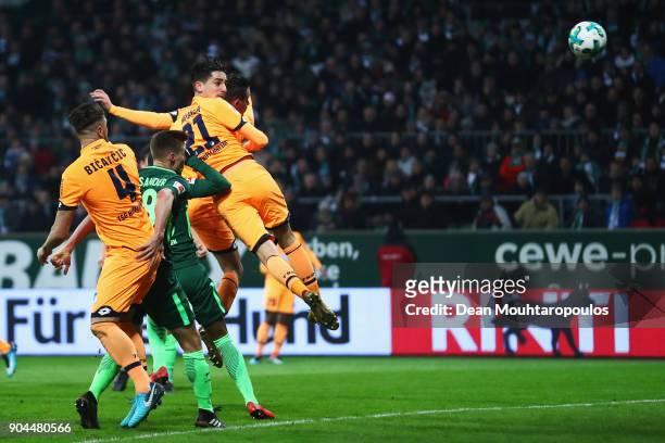 Benjamin Hubner of TSG 1899 Hoffenheim heads the ball from the corner to score the first goal of the game during the Bundesliga match between SV...
