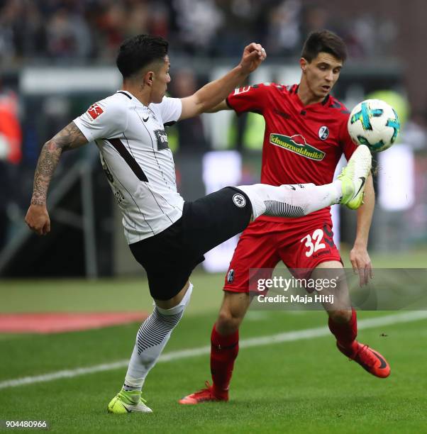 Carlos Salcedo of Frankfurt fights for the ball with Bartosz Kapustka of Freiburg during the Bundesliga match between Eintracht Frankfurt and...