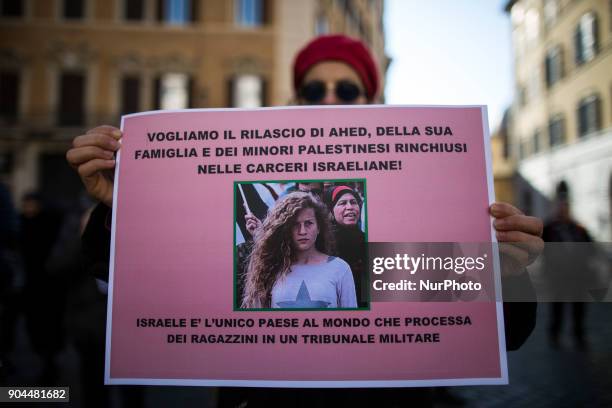 An activist holds a paper with a sign to ask the liberation of Ahed Tamimi in front of italian Parliament on January 13, 2018. A hundred of activists...