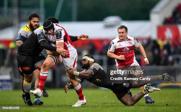 Belfast , United Kingdom - 13 January 2018; Kieran Treadwell of Ulster is tackled by Mohamed Boughanmi, left, and Levani Botia of La Rochelle during...