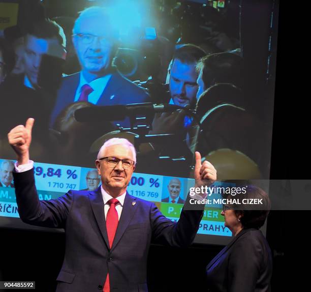 Former head of the Czech Academy of Sciences and candidate for the presidential election Jiri Drahos gestures next to his wife Eva at his election...