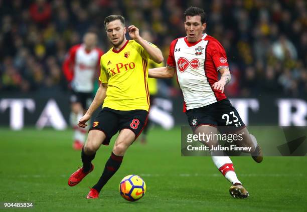 Tom Cleverley of Watford is challenged by Pierre-Emile Hojbjerg of Southampton during the Premier League match between Watford and Southampton at...