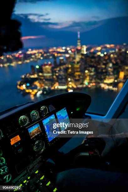 new york, new york city, city at night seen from helicopter - helicopter cockpit stock pictures, royalty-free photos & images