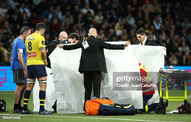 Samuel Ezeala of Clermont, suffering from a severe concussion, is evacuated from the pitch during the Top 14 rugby match between Racing 92 and ASM...