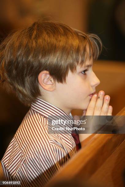 Catholics pray during a special mass to commemorate the Canadian visit of the forearm of Saint Francis Xavier, a popular saint revered by Catholics...