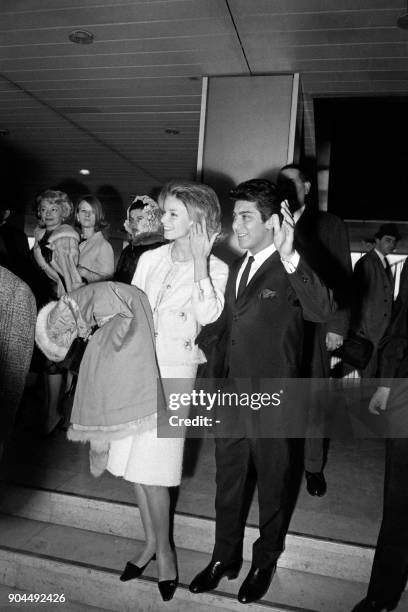 Canadian singer Paul Anka and his wife Anne de Zogheb wave before their departure to Zurich at the Orly airport on February 16, 1963 after...