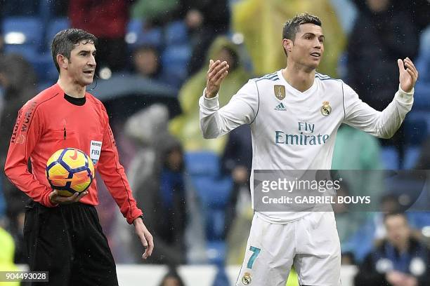 Real Madrid's Portuguese forward Cristiano Ronaldo reacts after his penalty appeal was rejected by Spanish referee Alberto Undiano during the Spanish...