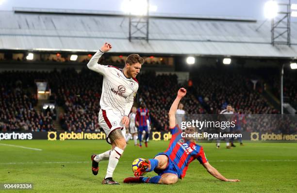 Martin Kelly of Crystal Palace tackles Jeff Hendrick of Burnley during the Premier League match between Crystal Palace and Burnley at Selhurst Park...